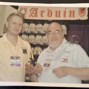 Dave Bukata and Gary Gygax with dragon and grey horror Gen Con